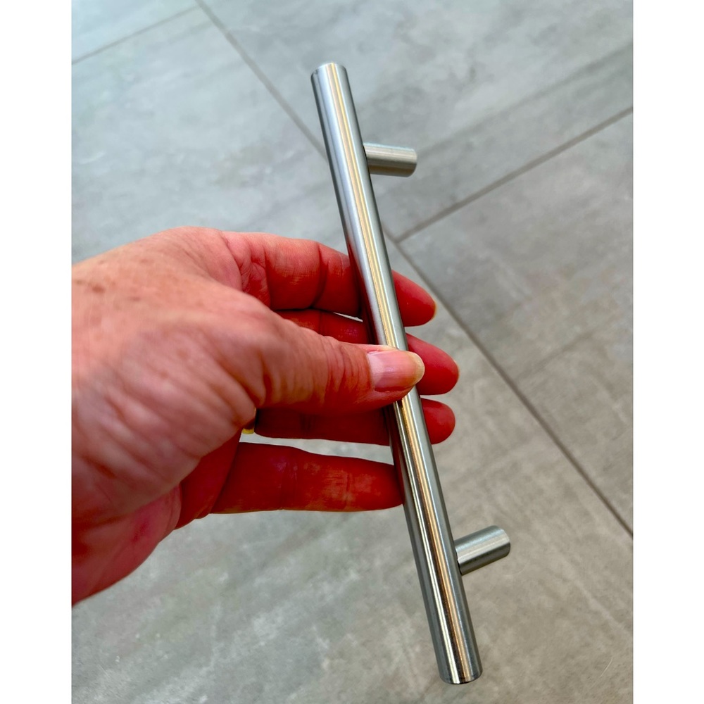 NIB cabinet hardware! Brushed nickel finish in cool design. 19 w 2 screw sizes